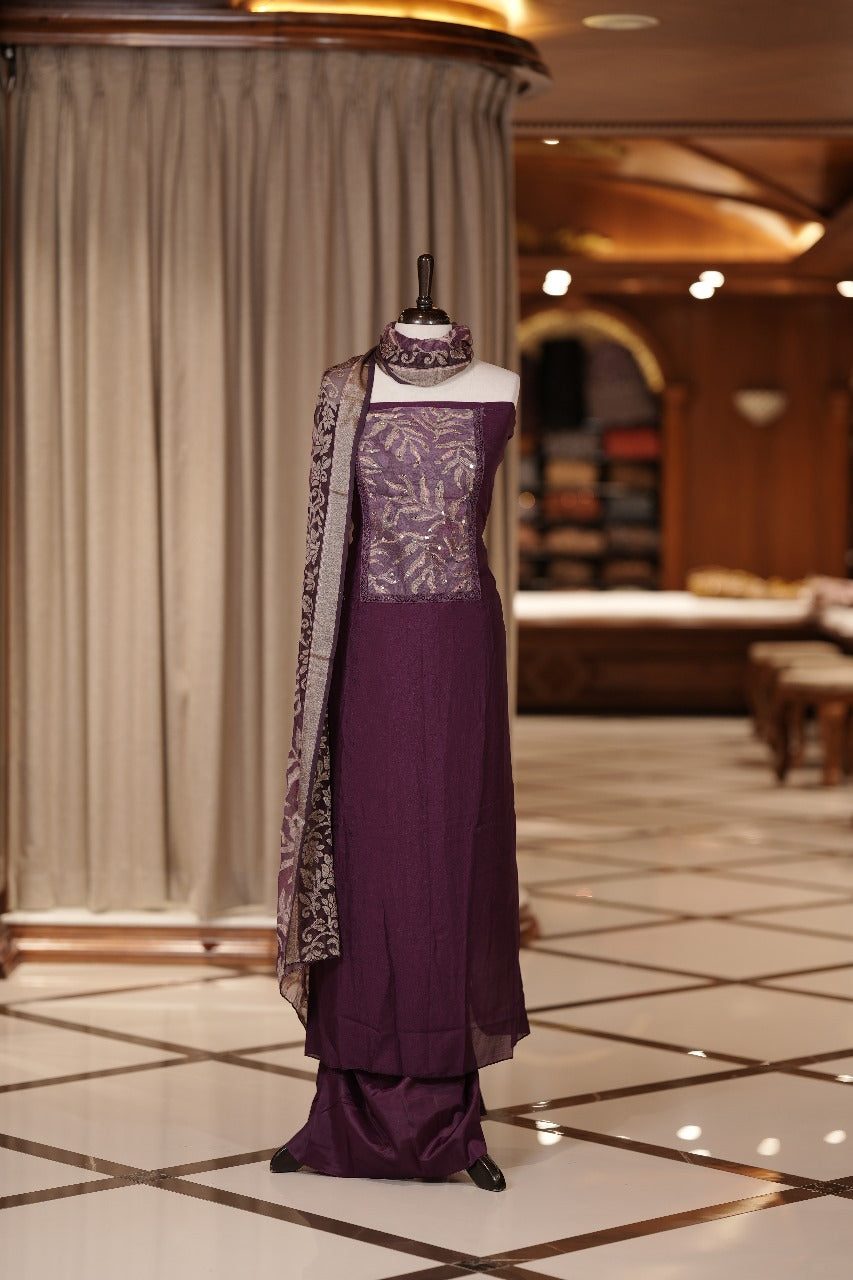 Wine colour Vichithra silk Salwar suit featuring rich Leaf design & Mirror worked neckline, Chiffon printed dupatta & paired with a plain bottom.