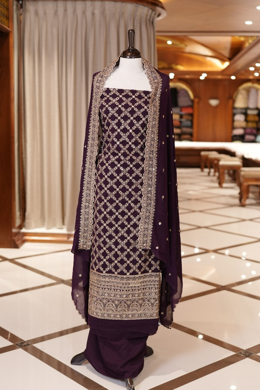 Wine Colour Georgette top adorned with gold zari and sequin work, paired with a scallop bordered dupatta featuring golden zari embroidery and a plain bottom.
