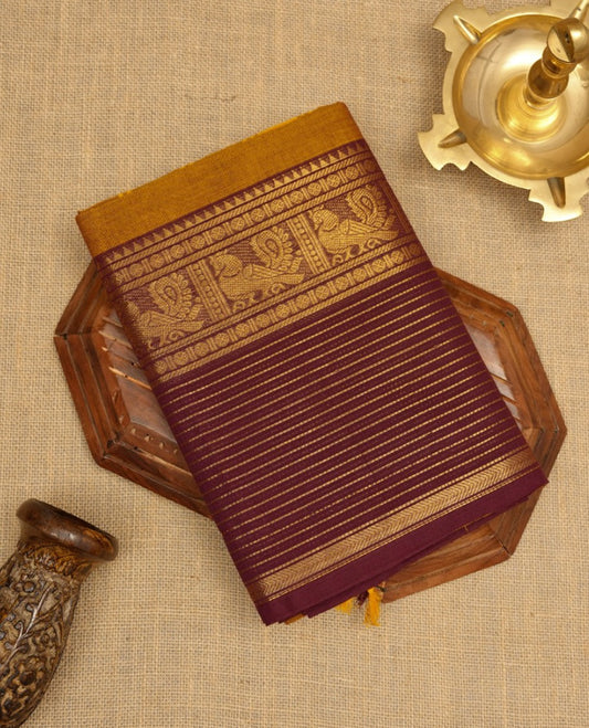 Mustard colour Chettinad cotton saree with a plain body, featuring a traditional border and pallu in contrast maroon colour, paired with a matching blouse piece.