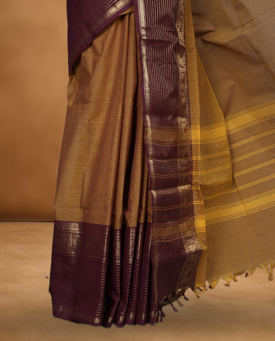Mustard colour Chettinad cotton saree with a plain body, featuring a traditional border and pallu in contrast maroon colour, paired with a matching blouse piece.