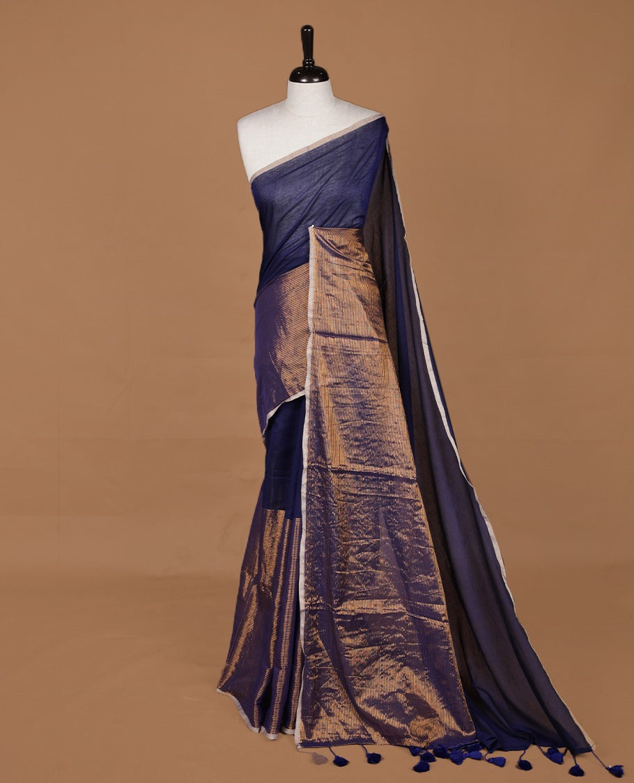 Blue mul cotton saree with an elegant half and half design, blending plain fabric with a contrasting tissue finish, without blouse piece.