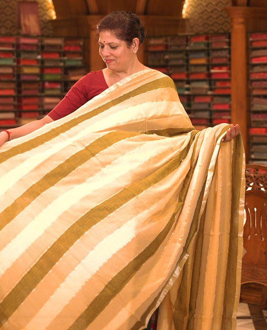 Yellow colour Mul cotton saree featuring stripes on body, without border, without blouse piece.