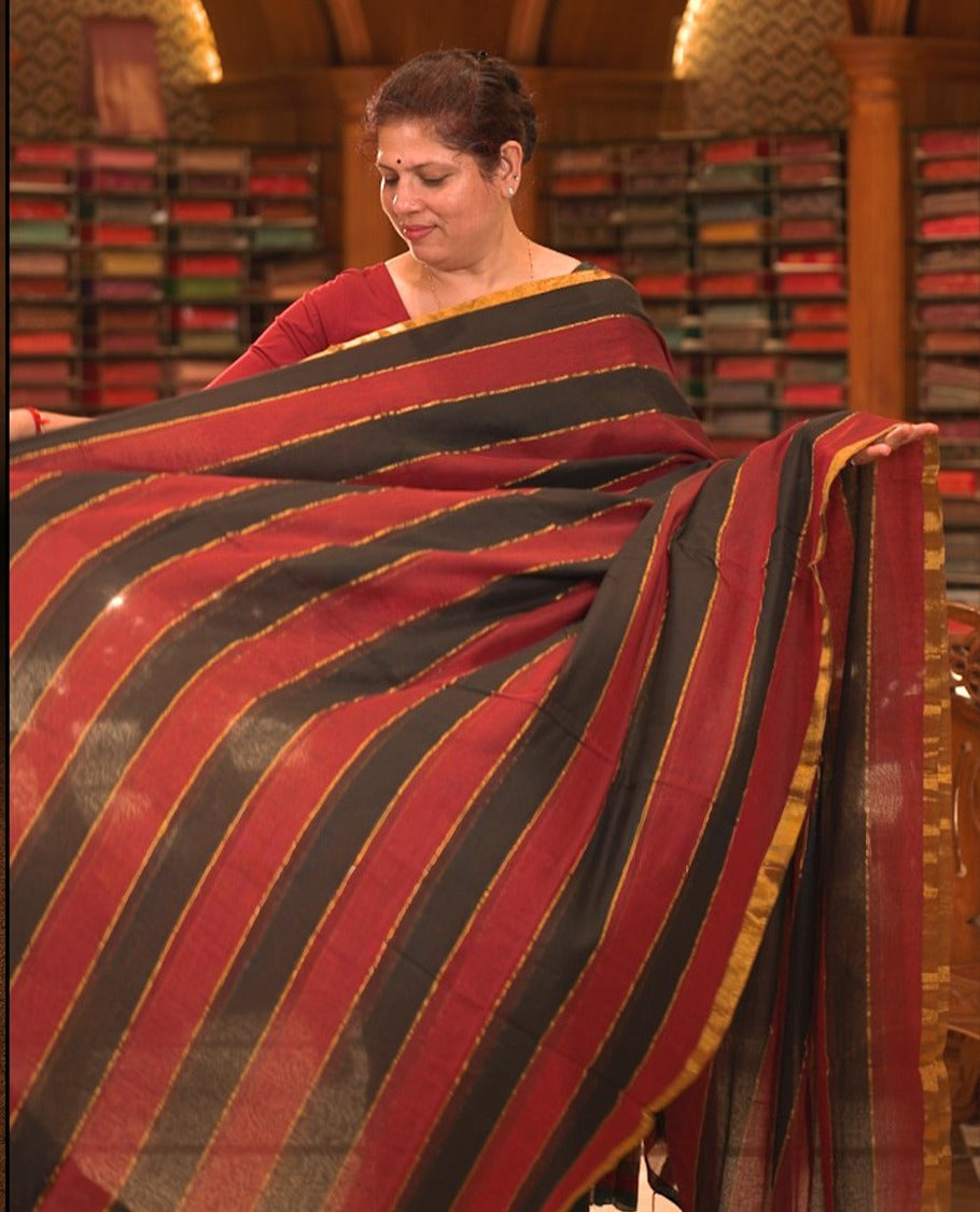 Red & Black colour Mul cotton saree featuring stripes on body, without border, without blouse piece.