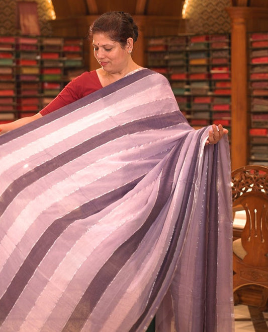 Purple colour Mul cotton saree featuring stripes on body, without border, without blouse piece.