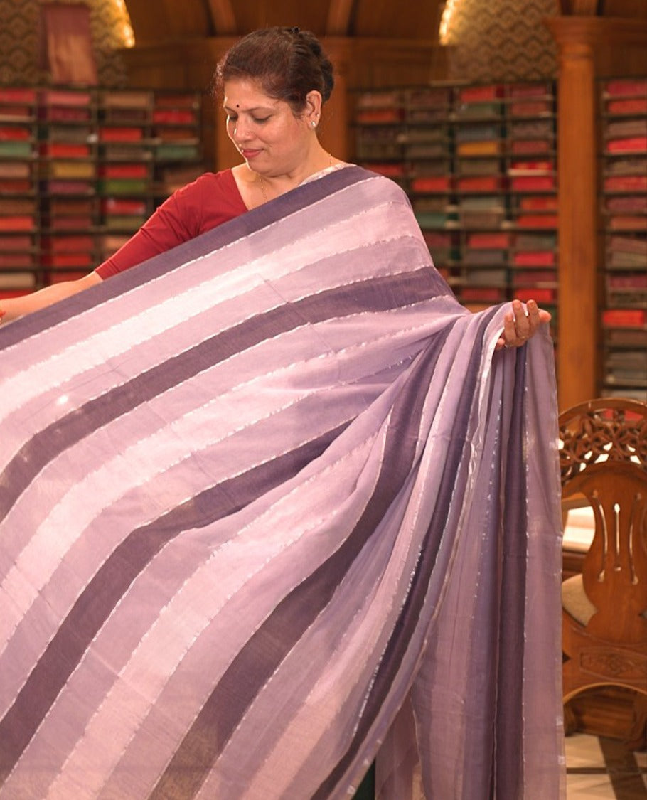 Purple colour Mul cotton saree featuring stripes on body, without border, without blouse piece.