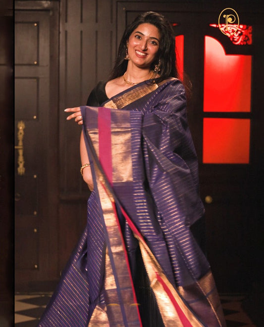 Blue colour chettinad cotton saree Highlighting Gold zari striped body, contrast pink colour traditional border, paired with matching blouse piece.