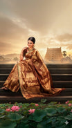 Dark Maroon colour Kanchipuram Samudrika Pattu saree featuring an exclusive gold zari weave of the historic Padmanabhaswamy Temple East Gopuram on the border and pallu, with Anantha Sayanam motif, paired with self colour blouse piece.