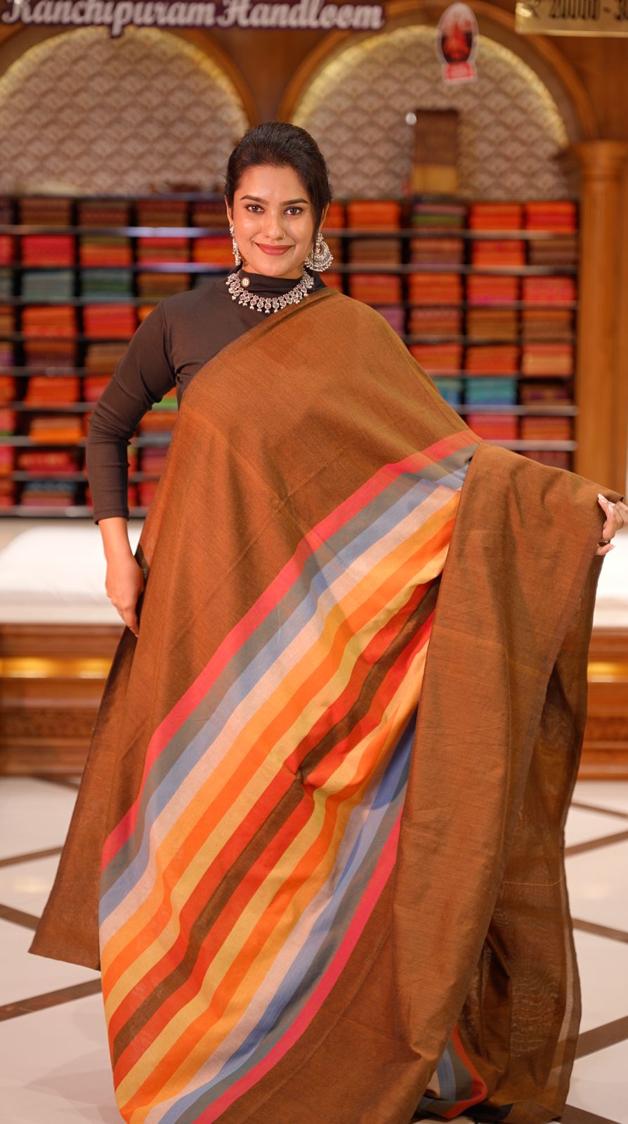 Light Brown Colour Mul Cotton Saree featuring Multi colour Line pattern on body, enhanced with Multi colour Pallu.
