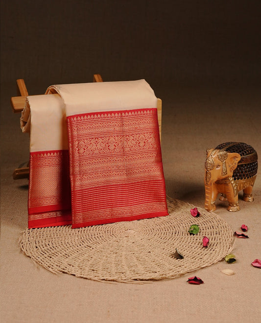 Cream colour Traditional Kancheepuram silk saree featuring gold zari motifs on body, enhanced with contrast Orange with traditional border, paired with matching blouse piece.