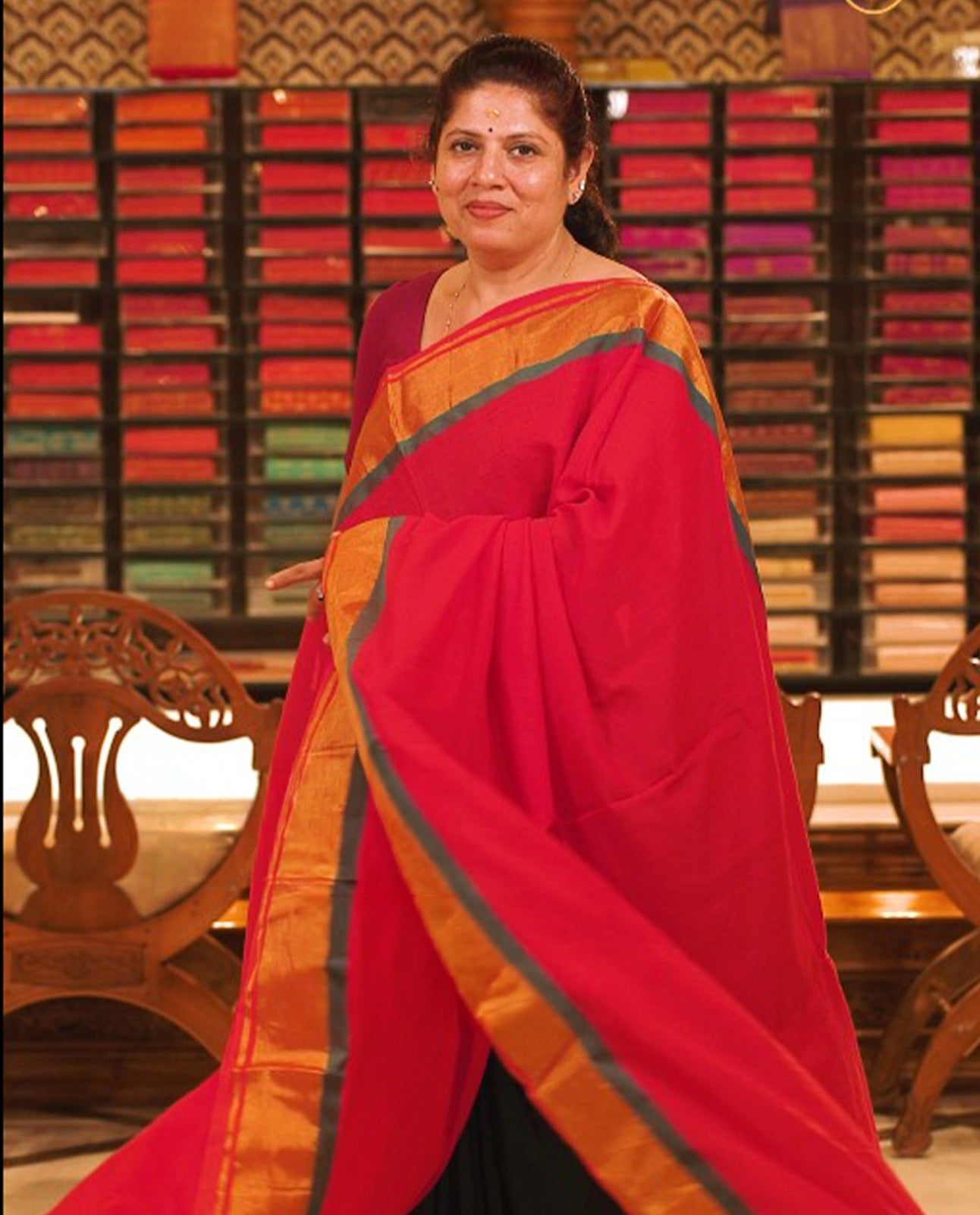 Red colour Mul Cotton saree featuring a simple plain body with a contrast border, offering a classic and elegant look. Comes without a blouse piece.