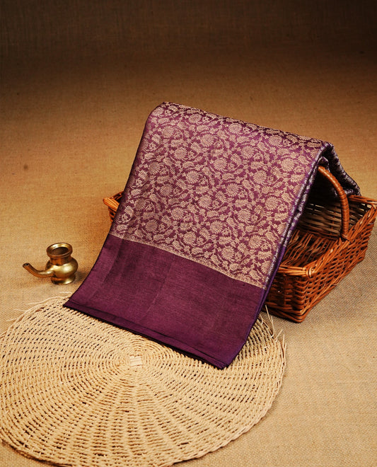 Purple colour Pure tusser silk saree featuring  Light Gold Zari floral Kodi Work On Body , A Plain  border & Grand  pallu ,Paired With  a matching blouse piece.