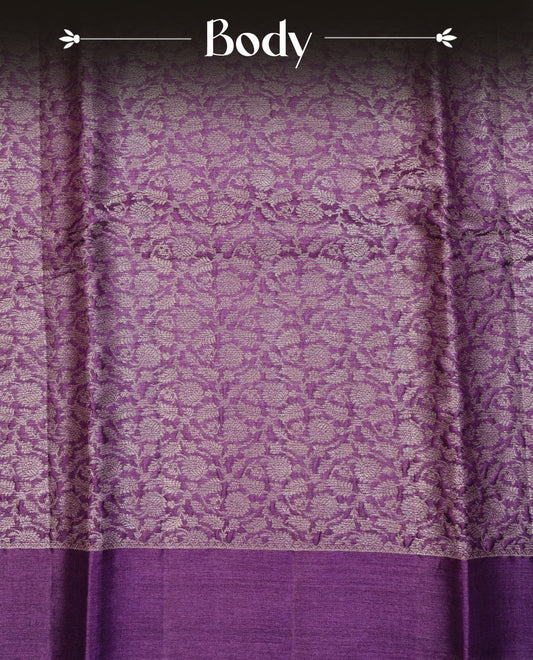 Purple colour Pure tusser silk saree featuring  Light Gold Zari floral Kodi Work On Body , A Plain  border & Grand  pallu ,Paired With  a matching blouse piece.