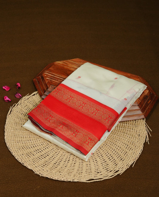 Off White  Colour Semi Silk Saree Featuring   Red thread buttas On Body, Highlighted  by contrast border with Mango motifs, paired with matching blouse piece.