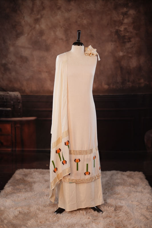 White colour Semi silk Salwar Material Featuring Traditional Gold Kasav With Lotus print border, paired with matching Semi silk Dupatta & bottom.