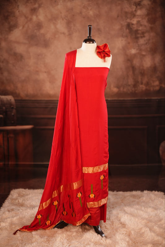 Red colour Semi silk Salwar Material Featuring Traditional Gold Kasav With Lotus print border, paired with matching Semi silk Dupatta & bottom.
