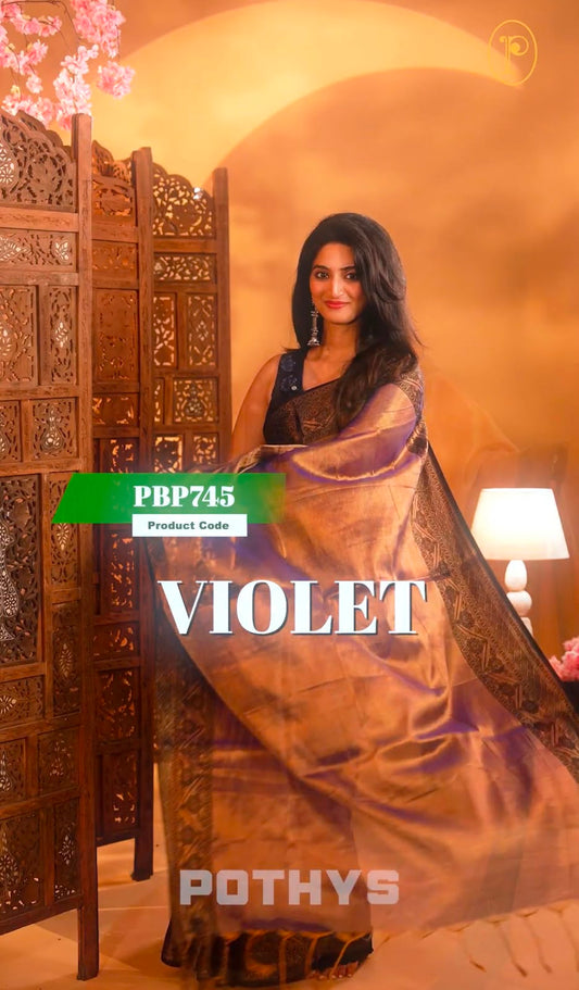 Violet  Colour Semi-Tissue Saree with a plain body and intricate thread work border.