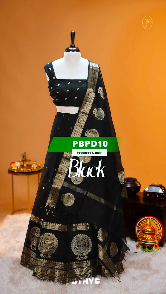 Black colour Chanderi Silk semi stitched Dhavani Set featuring beautiful Buttas on skirt With Kathakali Design border, same material dupatta with Same design & blouse.