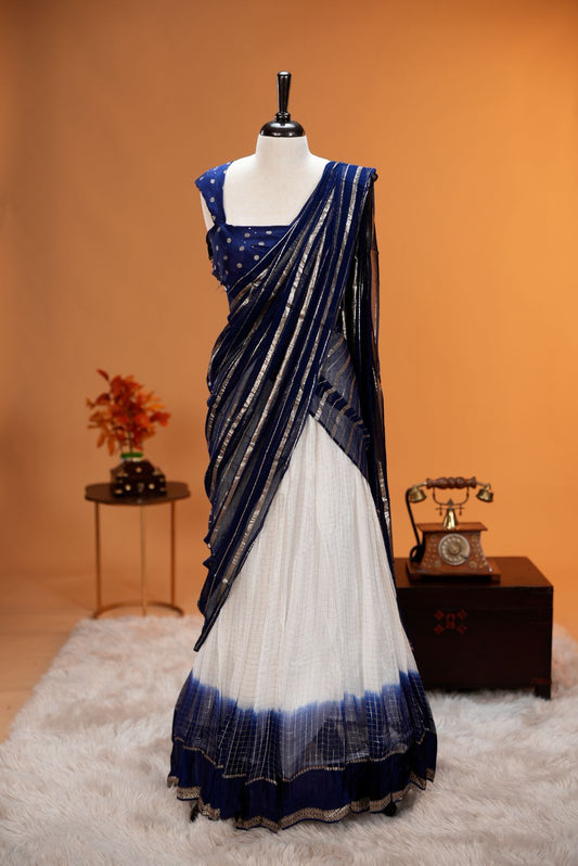 Blue colour Georgette Dhavani material featuring white skirt with Check pattern & contrast border, Small floral work on blouse piece, same colour dupatta with strips.