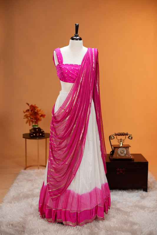 Pink colour Georgette Dhavani material featuring white skirt with Check pattern & contrast border, Small floral work on blouse piece, same colour dupatta with strips.