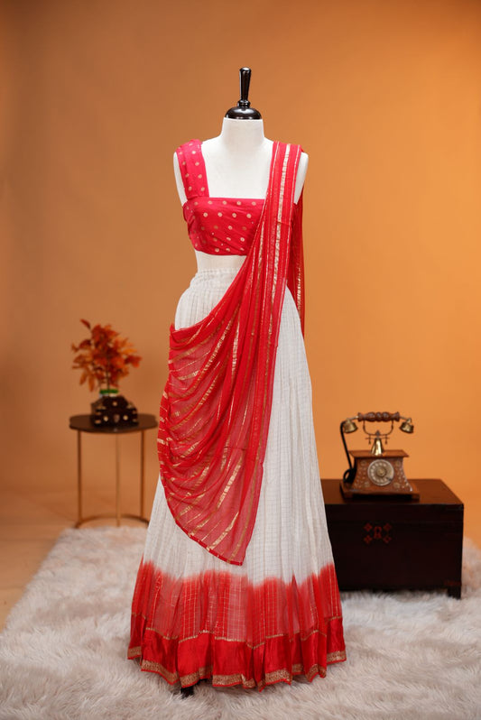 Red colour Georgette Dhavani material featuring white skirt with Check pattern & contrast border, Small floral work on blouse piece, same colour dupatta with strips.