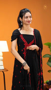 Black colour Georgette salwar material featuring red colour floral embroidery with sequins work on body & neckline , paired with santoon bottom, matching material dupatta scallop border.