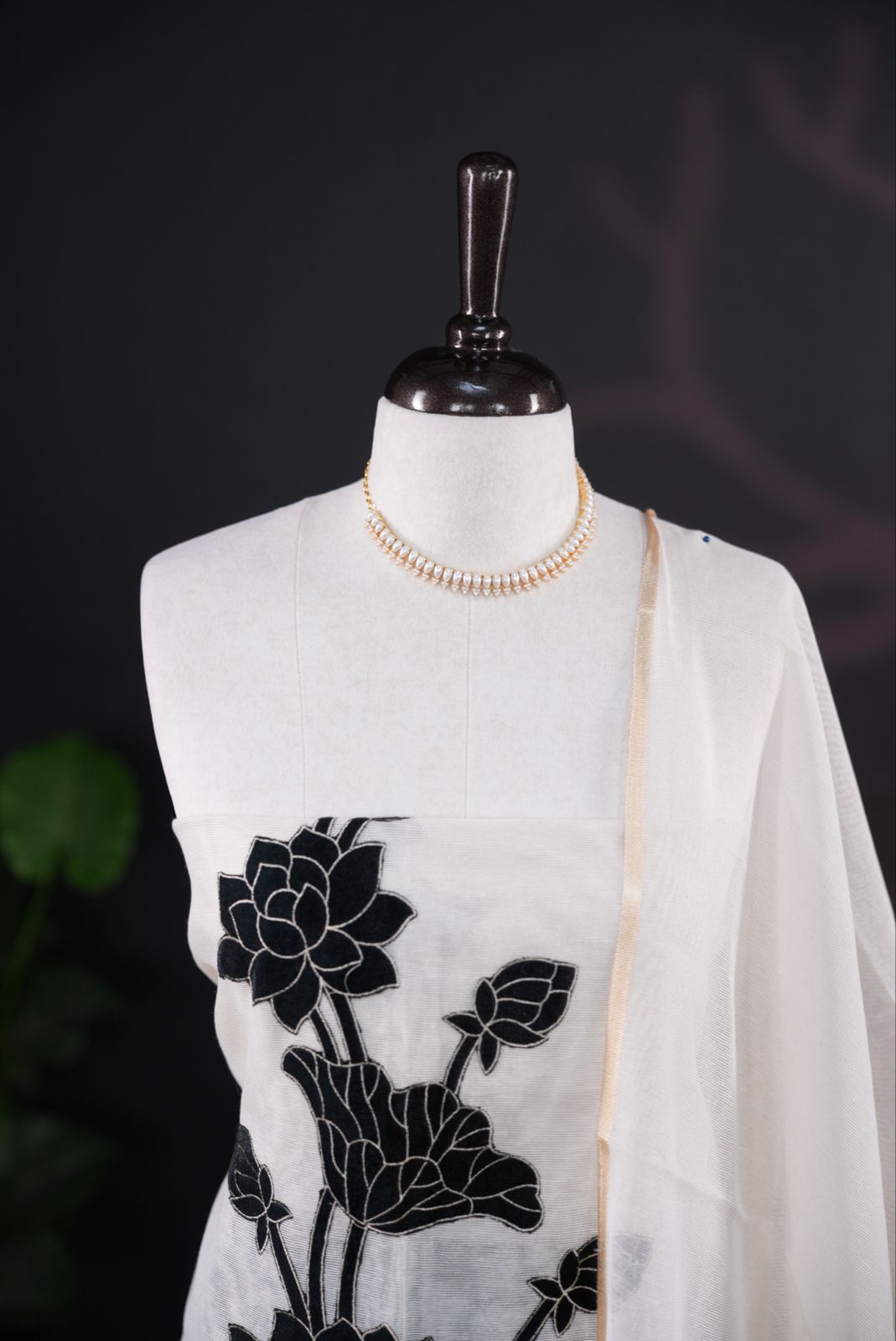 White net kota salwar material featuring Black Velvet applique work on body, paired with matching colour santoon bottom, elegant dupatta.