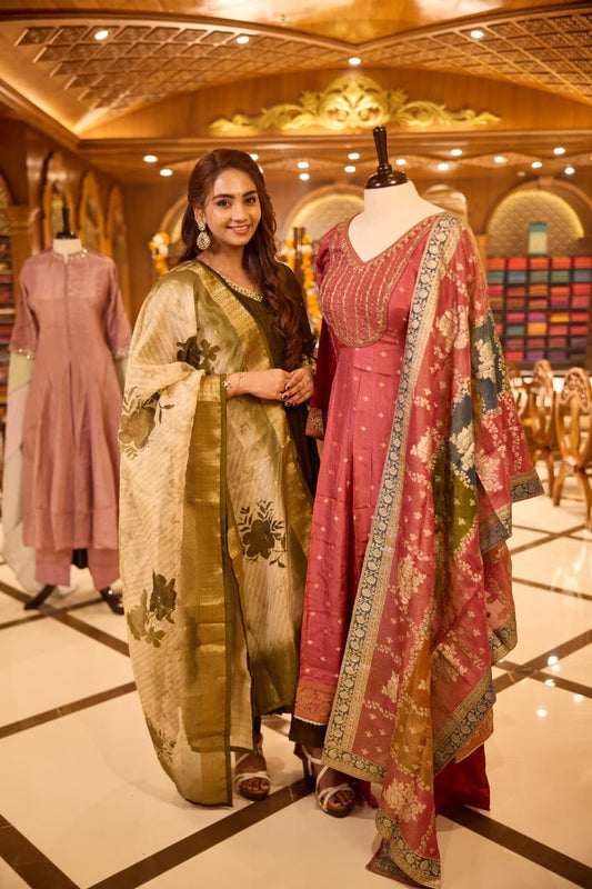 Dark Mauve colour Anarkali Suit with V neck embellished with cut beads, pearls, and sequins, Paired with a vibrant Banarasi dupatta featuring floral motifs and zari border & Comes with a plain matching bottom.