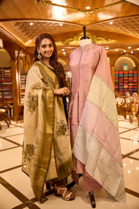 Onion pink colour Anarkali Suit featuring cut bead, pearl, and sequin work on the neckline and sleeves & Paired with a soft tri tone dupatta with plain bottom, perfect for festive and formal occasions.