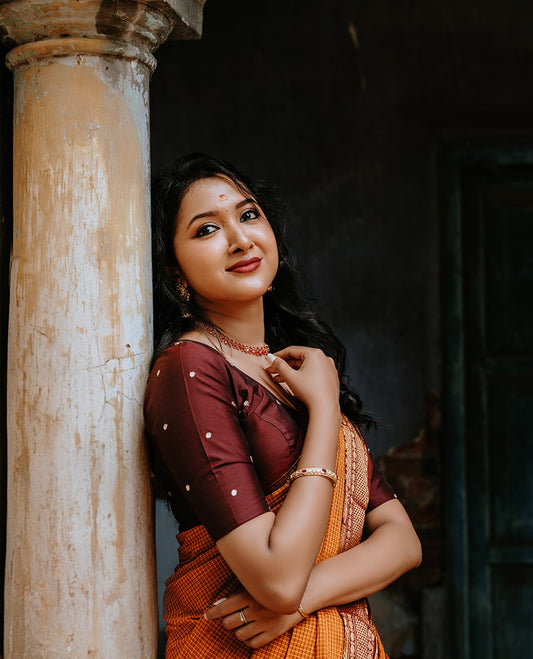 Mustard colour Chettinad cotton saree with a Checks on body, featuring a traditional border and pallu in Maroon colour, paired with a matching blouse piece