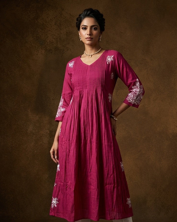 Wine colour embroidered kurti featuring a V-neckline with pintuck detailing, a calf-length silhouette, and three-quarter sleeves adorned with delicate floral thread work.