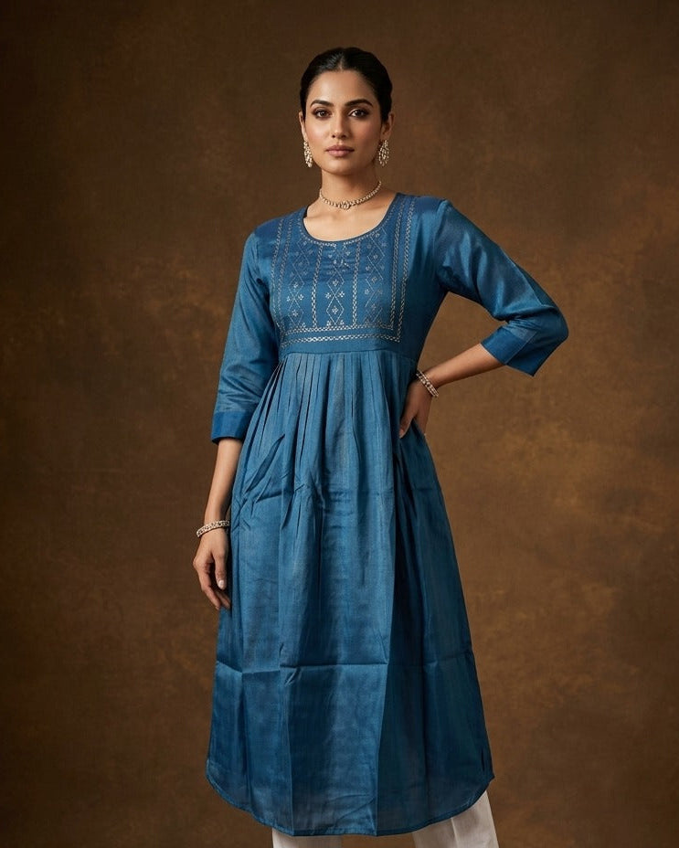 Teal  blue colour kurti highlighted with delicate cutwork motifs on the yoke, styled with a scoop neckline and comfy 3/4th sleeves.