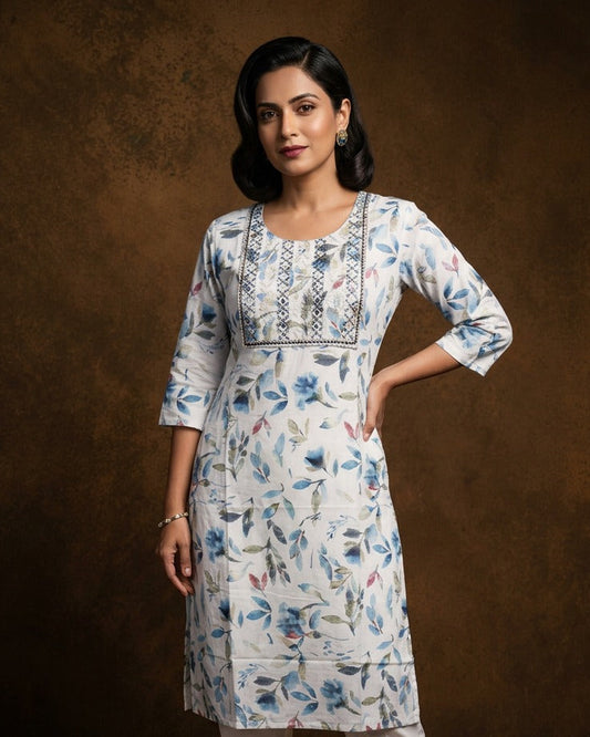 White colour kurti with styled with a thread pattern around neckline, print pattern across body, knee length design, and a sleeve .