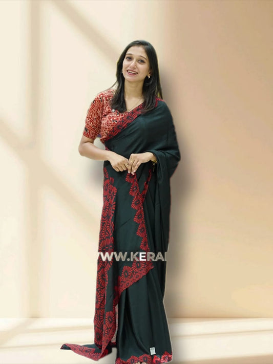 Black and red colour Turkey crepe saree with an bigcircle fancy print on the pallu, stylish printed border, and matching blouse.