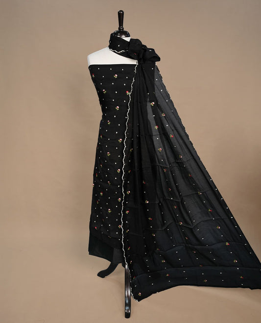 Black colour Mulchanderi salwar suit featuring thread floral buttas on the body and matching dupatta, paired with a santon bottom.