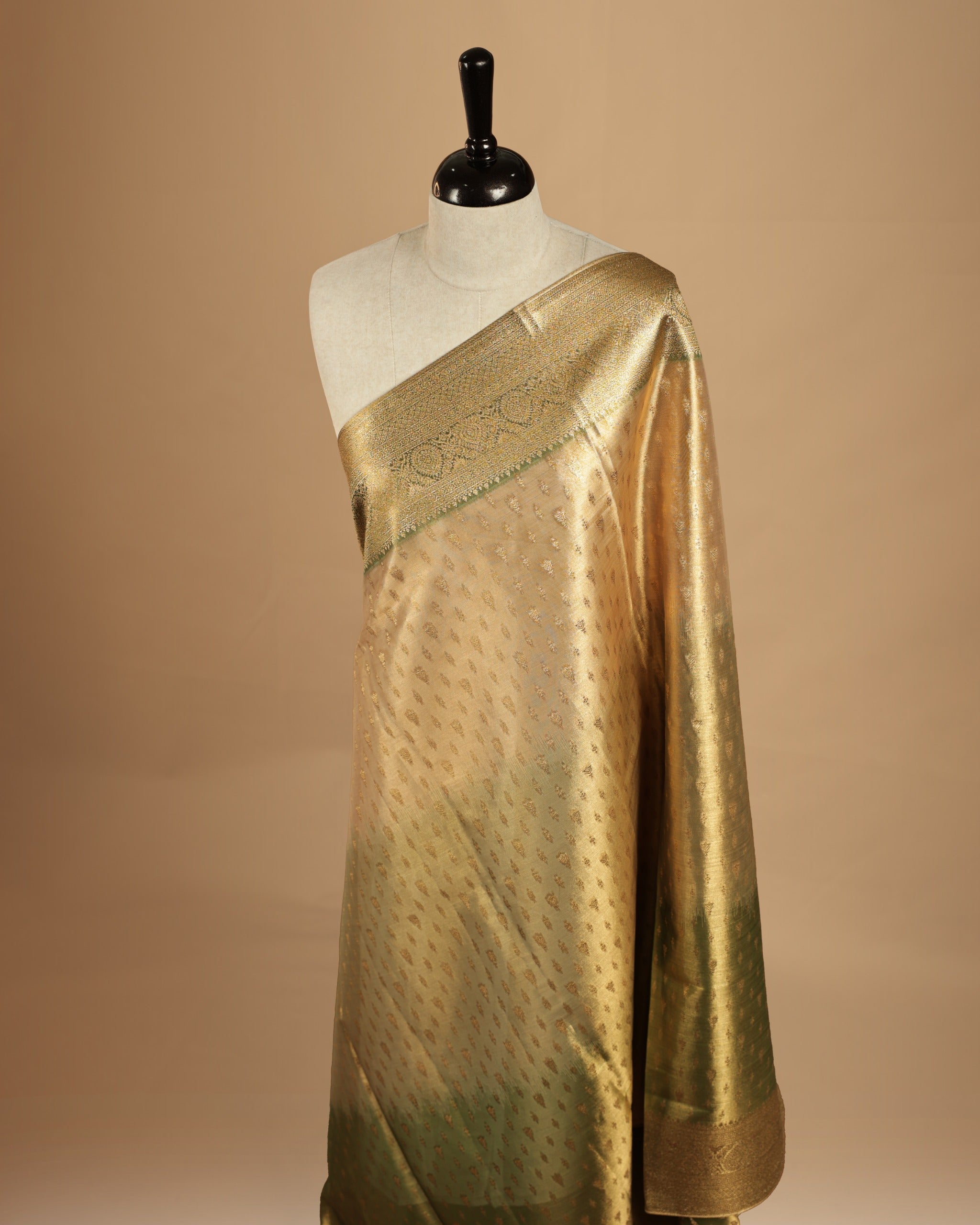 Green, light green, gold triple shade colour semi Tissue silk saree featuring gold zari motifs on body, complemented by gold zari traditional border, paired with matching blouse piece.