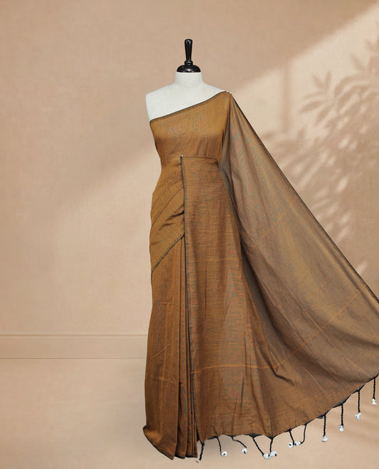 Mustard Colour Mul Cotton saree featuring Elegant plain body, Comes with no border, finished with stylish tassels.