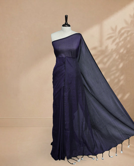 Navy Blue Colour Mul Cotton saree featuring Elegant plain body, Comes with no border, finished with stylish tassels.