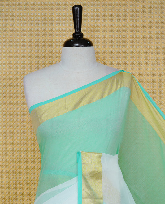 Pastel Mint with White Dual colour Mul cotton saree featuring Half & Half Dual Tone Plain Body, Complemented by Gold tissue Border & pallu.