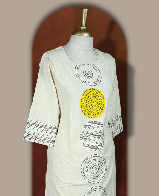 Cream colour cotton coord set with bold geometric prints and a pop of yellow, Features a round neck kurta with 3/4th sleeves and matching straight pants.