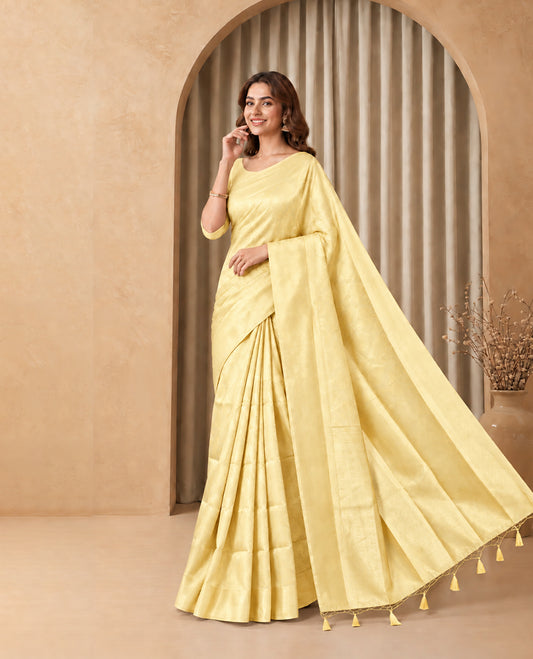 Butter Yellow  Colour  Elite Soft Silk Saree with silver zari leaf motifs on the body, a self Banarasi silver zari border and brocade pallu, Paired with a blouse Piece featuring small silver zari buttas.