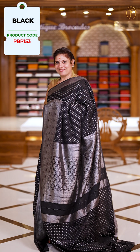 Black colour Semi Banaras georgette saree adorned with delicate silver zari motifs and a rich woven pallu & Comes with a  matching  blouse.
