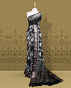 Black colour saree with off white floral and geometric prints, featuring a contrast zari border and beautifully detailed printed pallu & Comes with a matching black blouse piece.