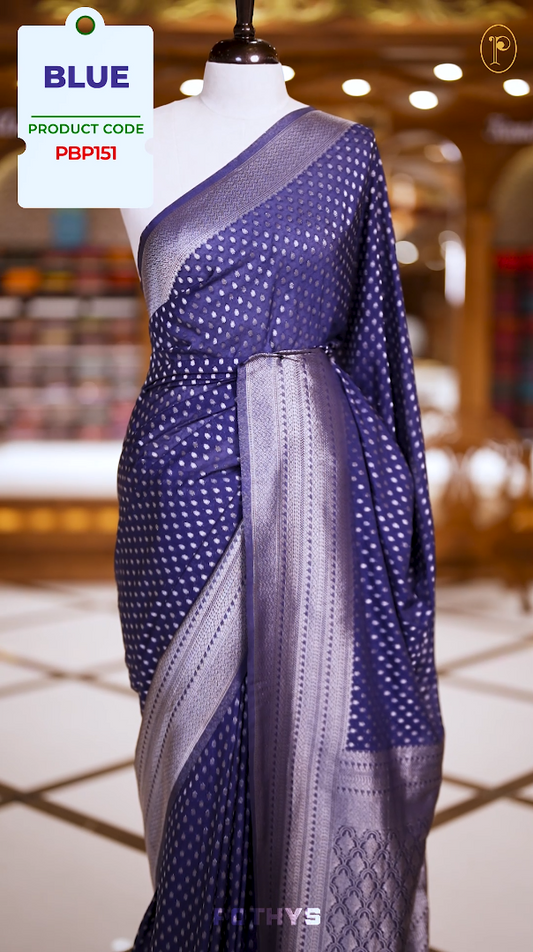 Blue colour Semi Banaras georgette saree adorned with delicate silver zari motifs and a rich woven pallu & Comes with a  matching  blouse.
