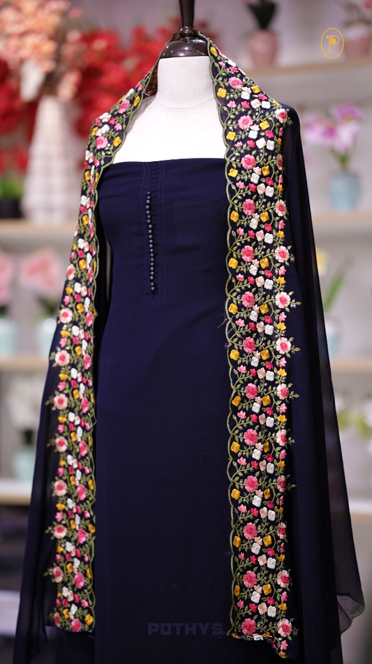 Turquoise blue colour Chiffon churidhar material featuring a plain top adorned with delicate beads work on the neckline, paired with a plain bottom, Highlighted by a dupatta with floral embroidery, sequins, and scalloped edges.