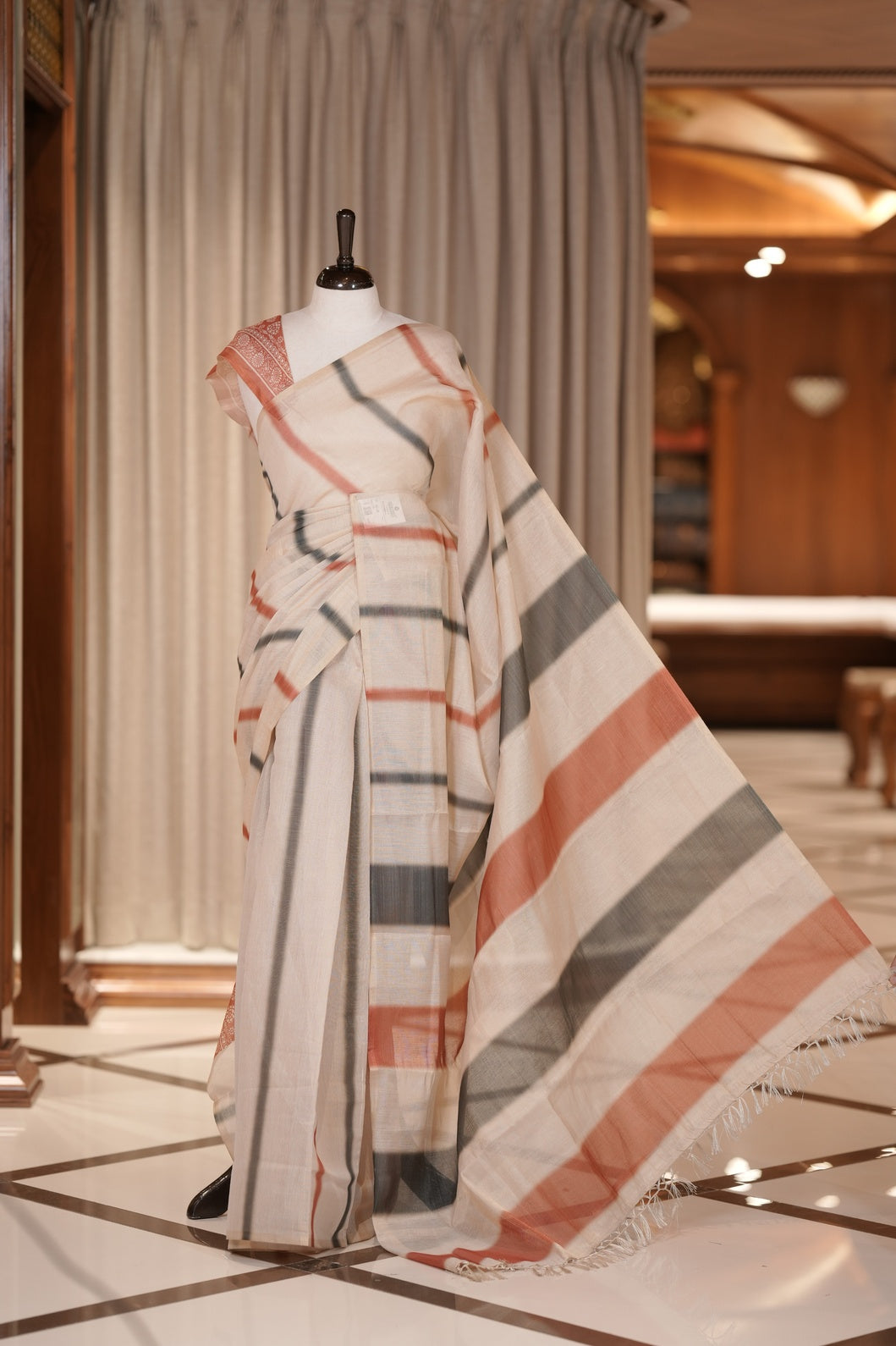 Brown & Black colour Linen printed saree featuring stylish fancy line prints all over, paired with a contrast colour printed blouse and a beautifully designed fancy line pallu.