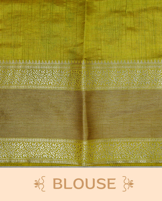 Cream colour semi Tussar silk saree featuring  Elegant body, Complemented by contrast Olive with rich zari detailed for onam special, paired with contrast Blouse for Festive look.