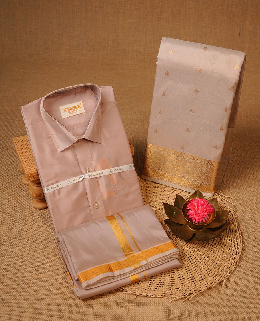 Sandstone colour shirt and dhoti with gold colour border, paired with matching colour silk saree featuring gold zari buttas and traditional border paired with matching blouse piece.