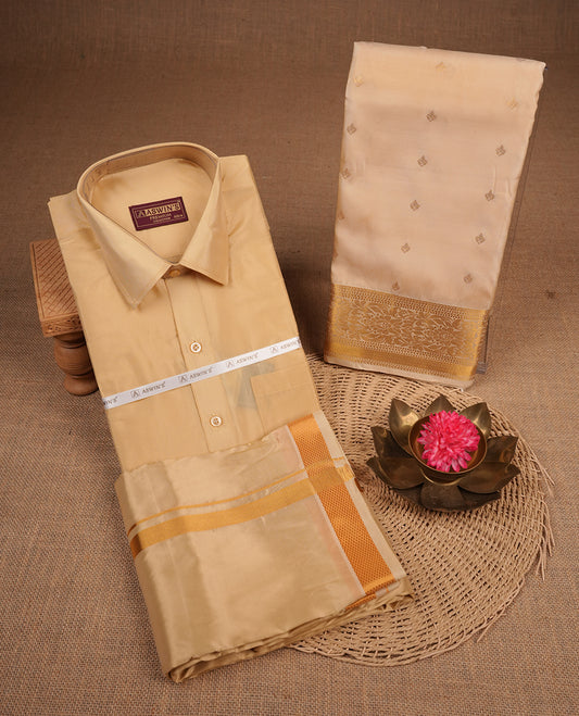 Biscuit colour shirt and dhoti with gold colour border, paired with matching colour silk saree featuring gold zari buttas and traditional border paired with matching blouse piece.
