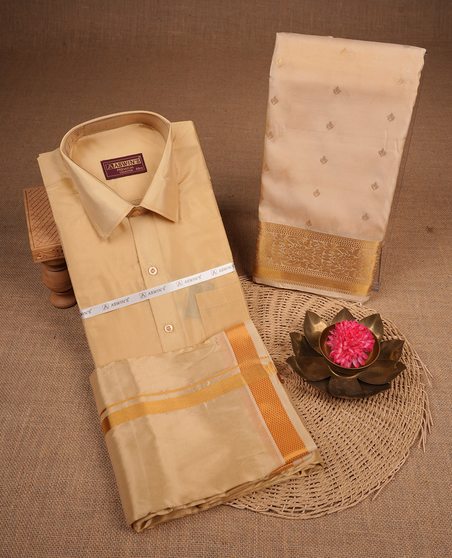 Biscuit colour shirt and dhoti with gold colour border, paired with matching colour silk saree featuring gold zari buttas and traditional border paired with matching blouse piece.