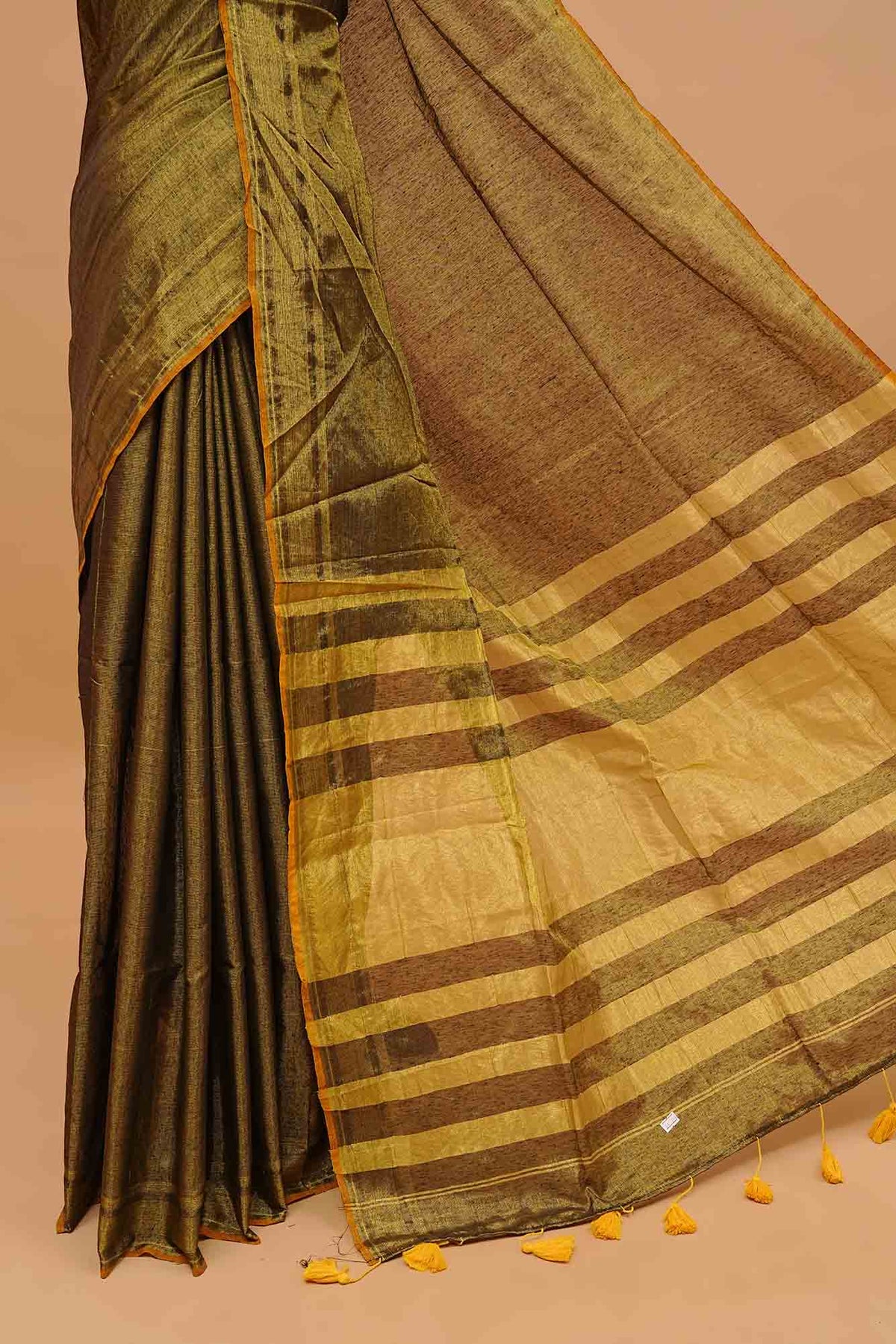 Green Colour & Gold Shade Tissue Mul Cotton Saree Featuring Plain body. With out Border Golden Strips on pallu comes With Tassels